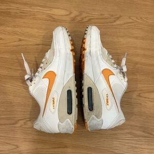 Nike White Sneakers with Orange Swoosh